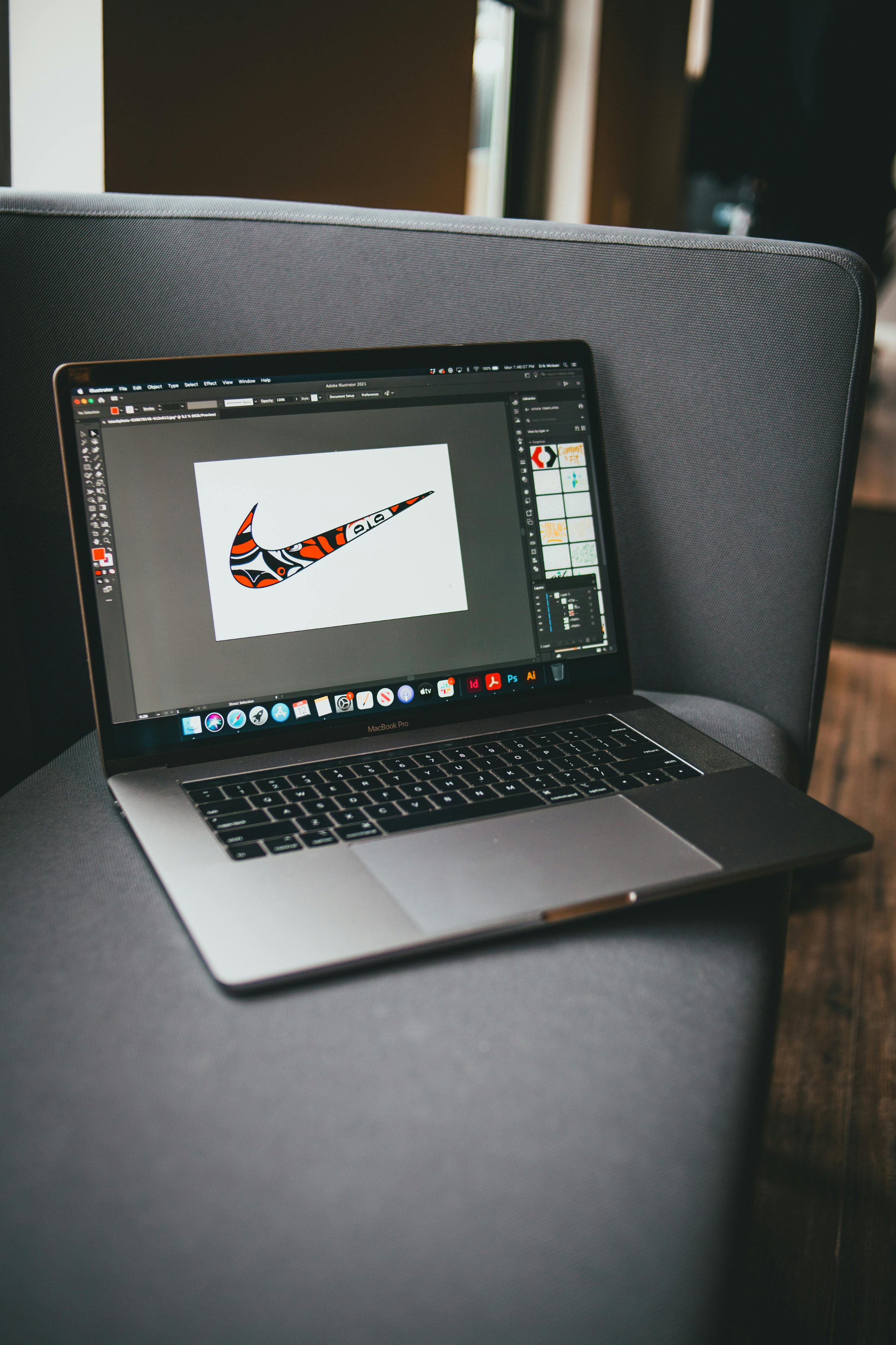 Photo of rows of books in a library with marble busts.